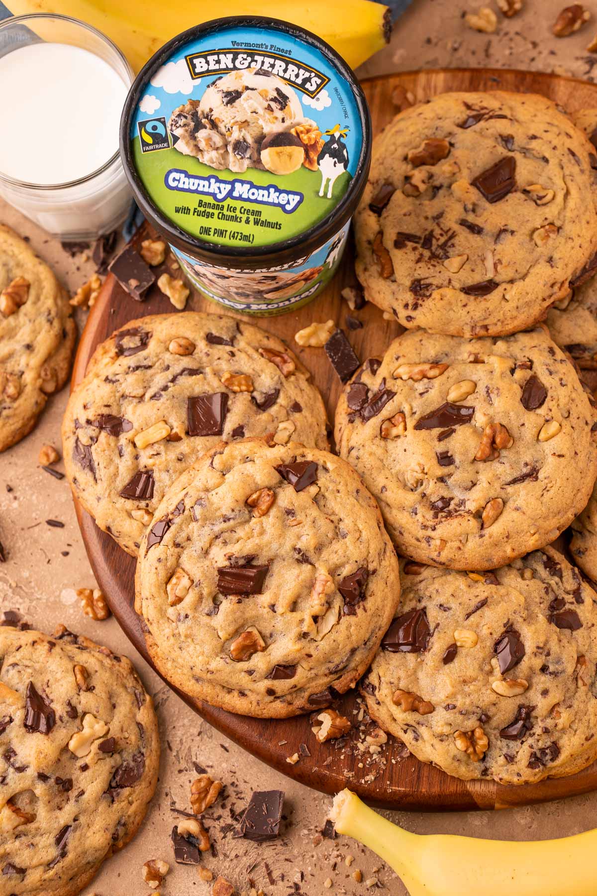 Overhead photo of Chunky Monkey Cookies on a wooden board.