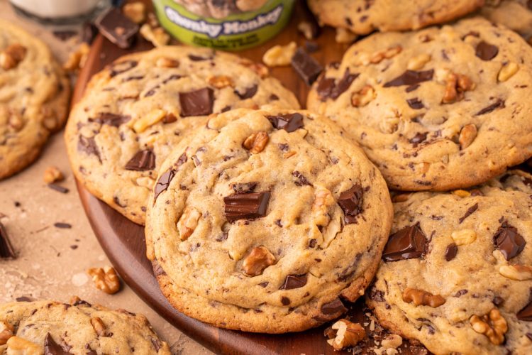Chunky Monkey Pudding Cookies on a wooden board.