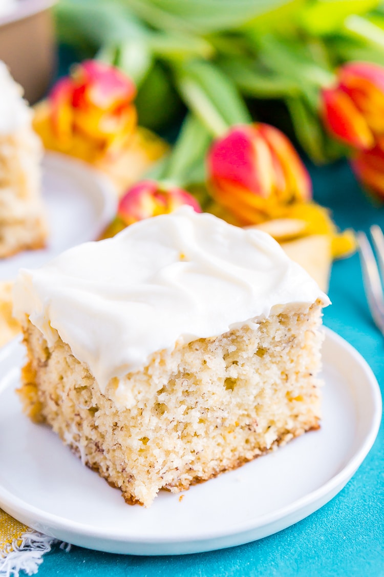 This is the Best Banana Cake recipe EVER! It's moist and sweet and topped with a tangy cream cheese frosting!