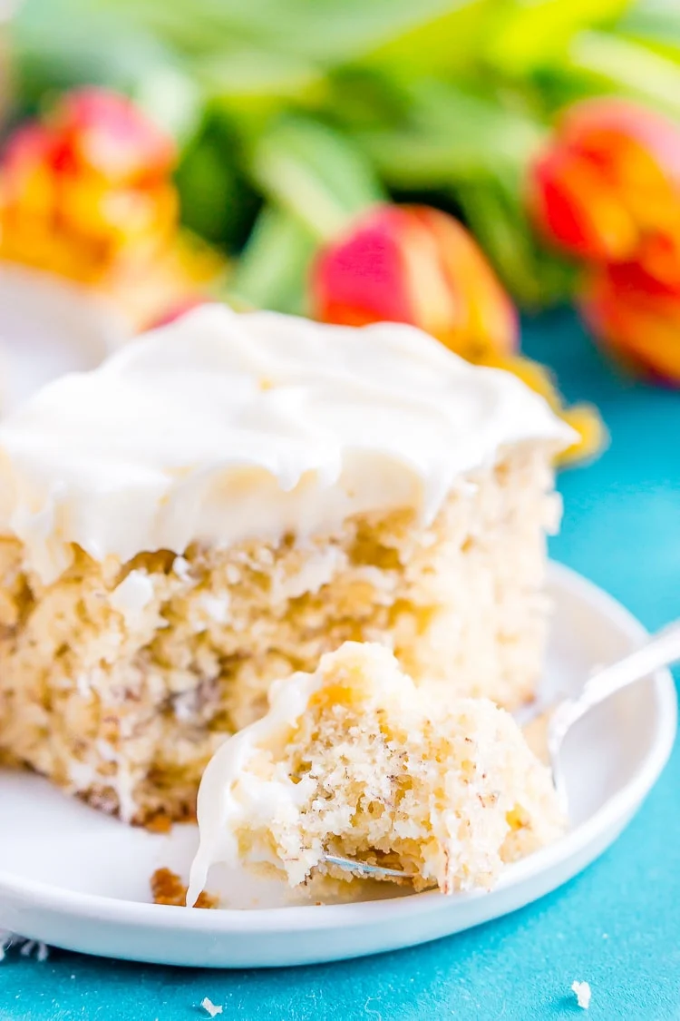 This is the Best Banana Cake recipe EVER! It's moist and sweet and topped with a tangy cream cheese frosting!