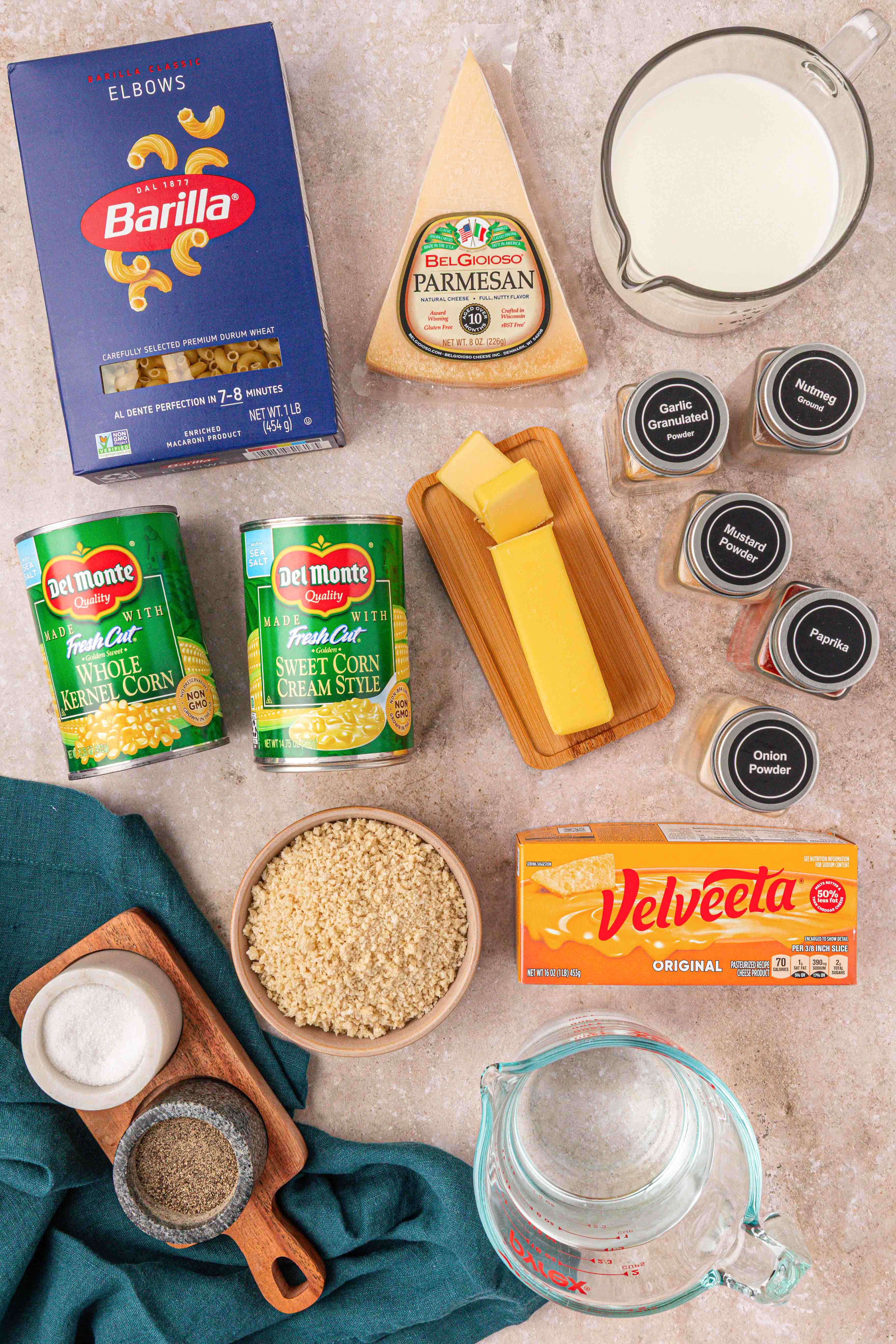Ingredients to make corn mac and cheese on a table.