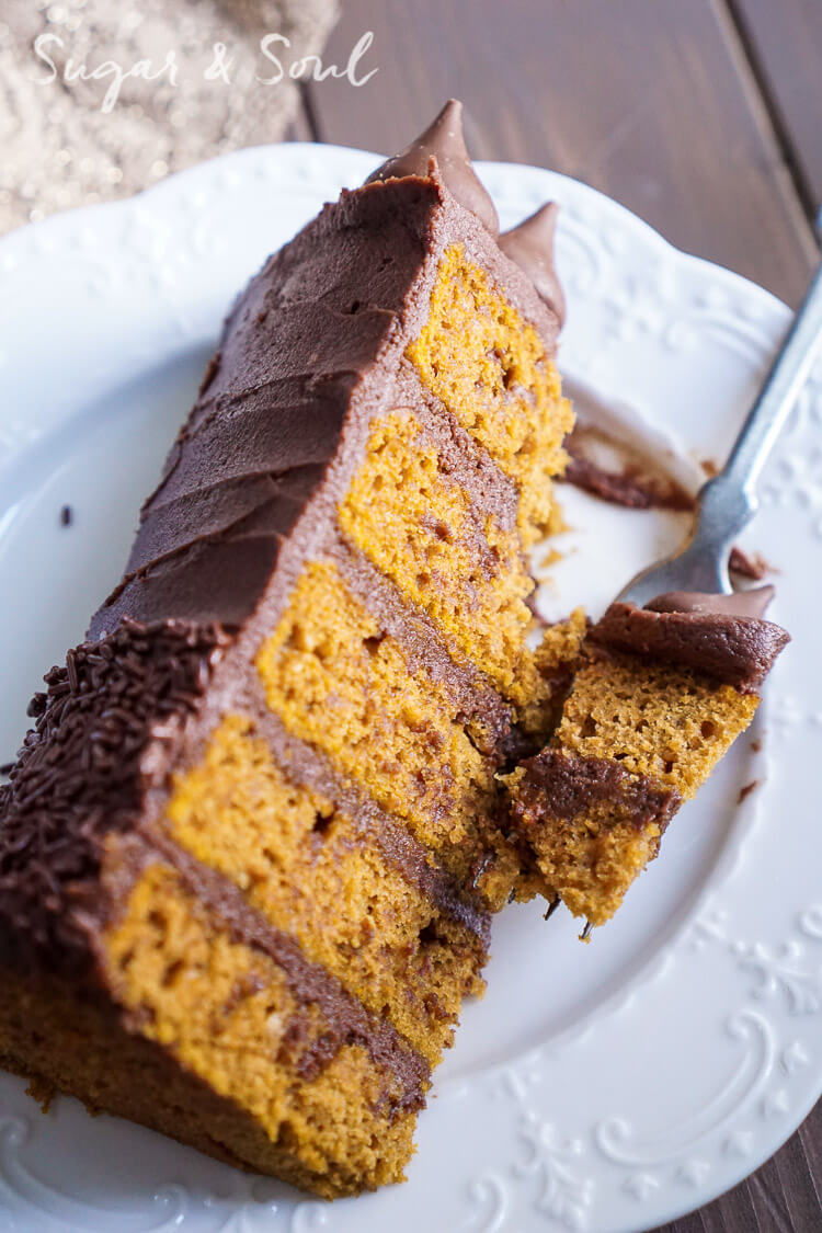 This Chocolate Pumpkin Cake is the ultimate pumpkin and chocolate combo for fall! Five layers of sweet and fluffy pumpkin cake wrapped in a whipped chocolate buttercream frosting!
