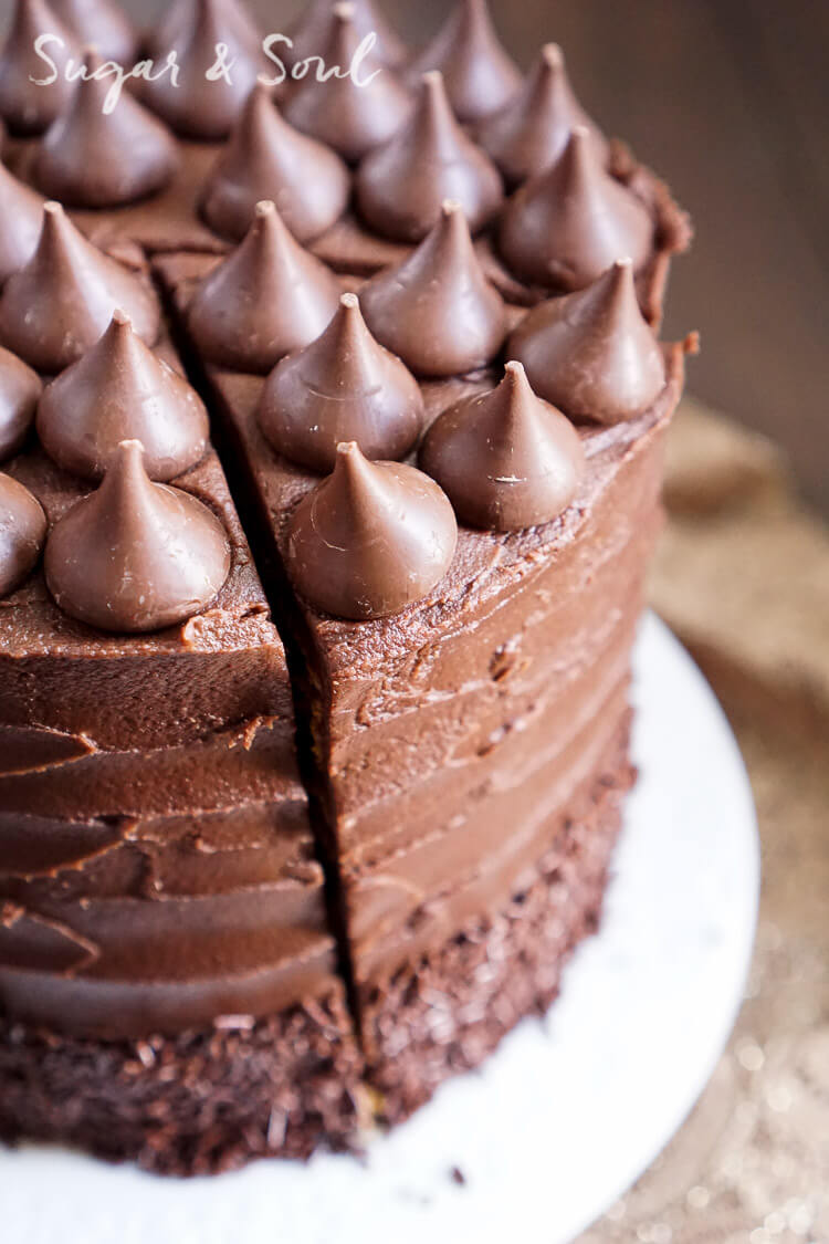 This Chocolate Pumpkin Cake is the ultimate pumpkin and chocolate combo for fall! Five layers of sweet and fluffy pumpkin cake wrapped in a whipped chocolate buttercream frosting!