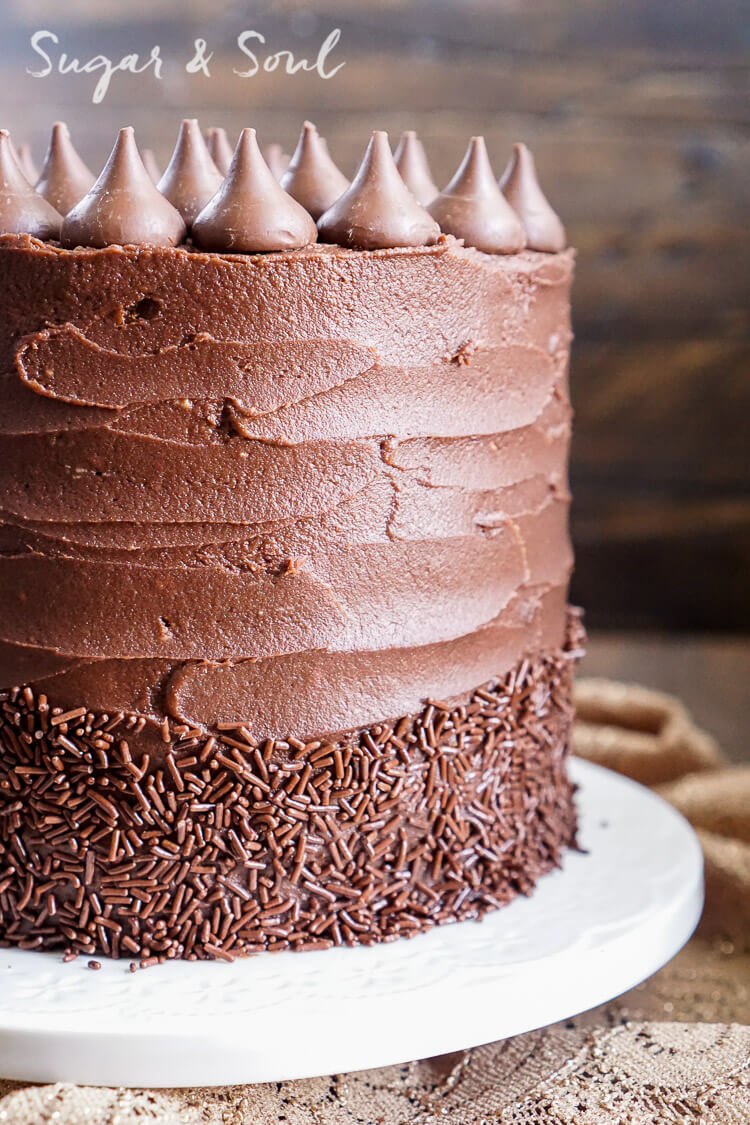This Chocolate Pumpkin Cake is the ultimate pumpkin and chocolate combo for fall! Five layers of sweet and fluffy pumpkin cake wrapped in a whipped chocolate buttercream frosting!