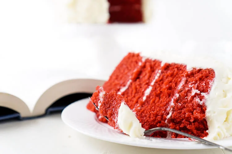 Red Velvet Cake, aka President Snow's White Rose Cake, is a red velvet cake frosted in cream cheese buttercream and inspired by The Hunger Games trilogy and perfect for Valentine's Day too!