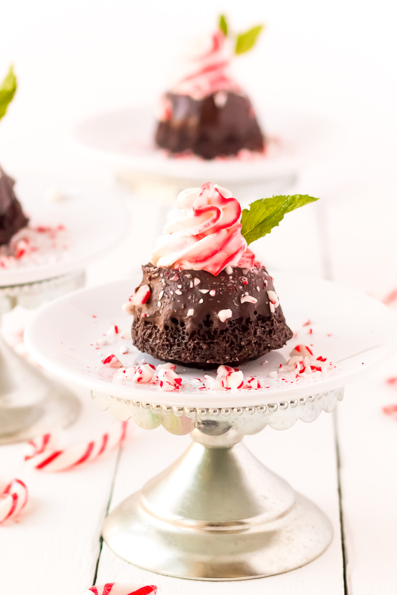 These Mini Chocolate Peppermint Bundt Cakes are a rich, decadent single-serve dessert made with cocoa powder, coffee, and topped with peppermint whipped cream, these treats taste like a coffeehouse favorite!