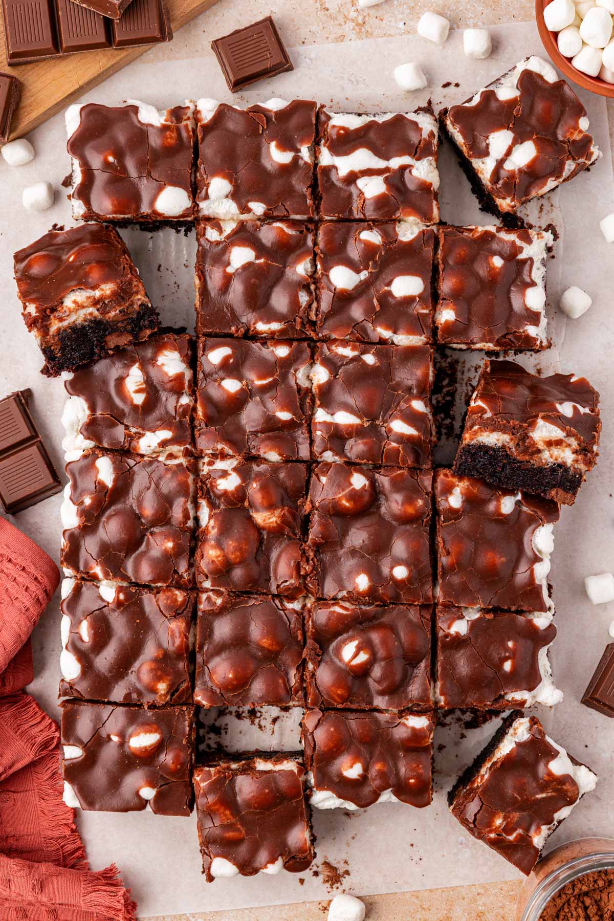 Overhead photo of a batch of Mississippi Mud Pie Brownies cut up on a table.