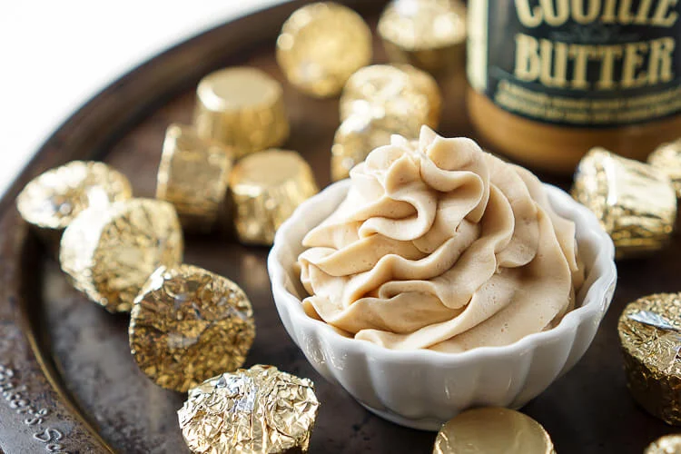This Cookie Butter Frosting recipe is creamy and fluffy and perfect for topping cupcakes, sandwiching between cookies, or frosting cakes with!
