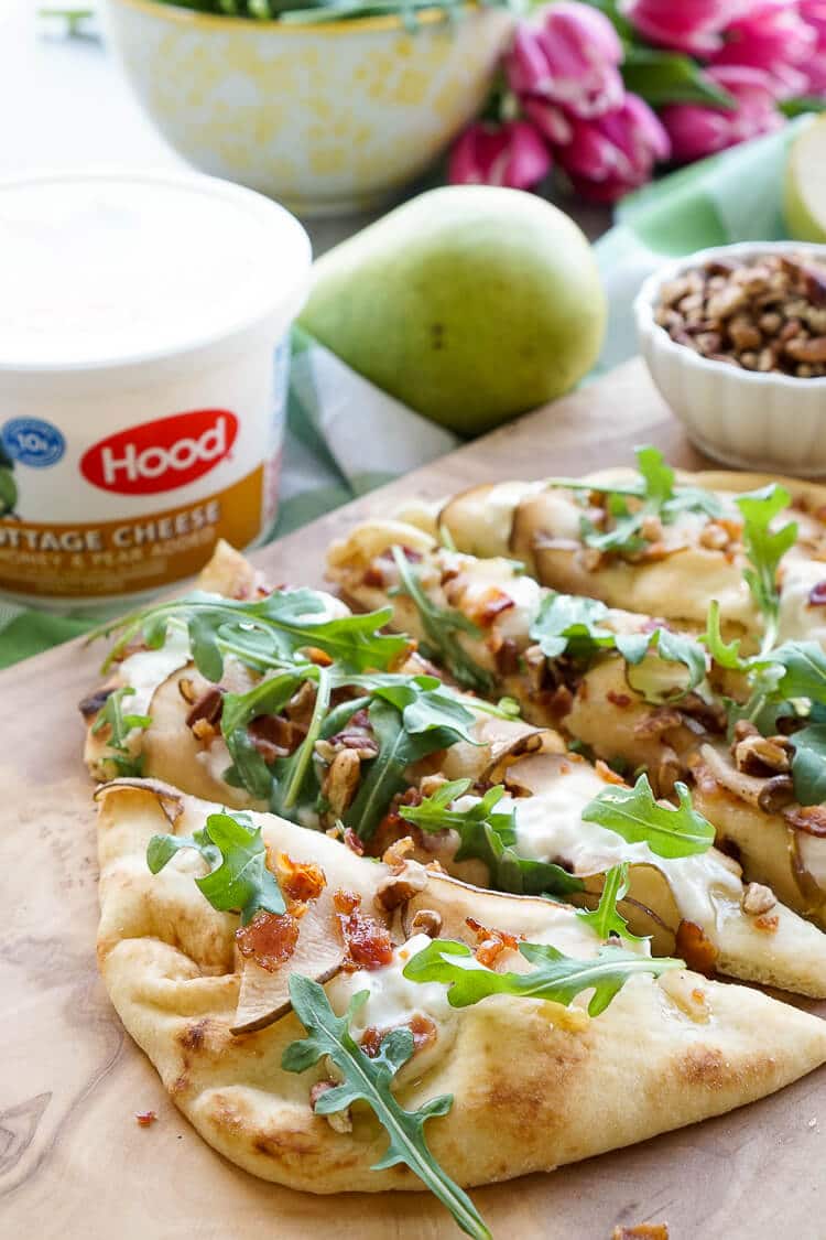This Honey Pear Pecan Bacon Flatbread is the perfect light lunch, snack, or appetizer and just the slightest bit sweet!
