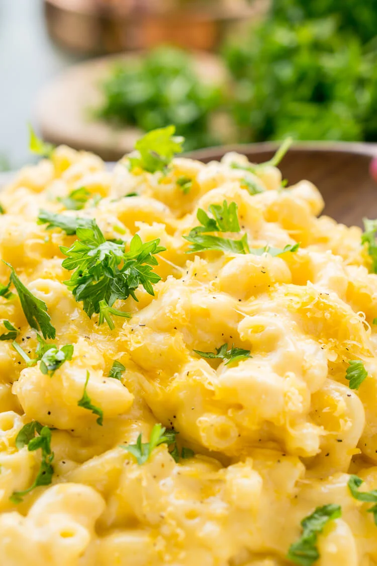 This really is the Best Ever Creamy Mac and Cheese! Made with sharp cheddar and Parmesan cheese, heavy cream and whole milk, richened with butter and kicked up with some mustard powder, you just can't go wrong! This stovetop mac and cheese recipe is on the table in just 25 minutes!