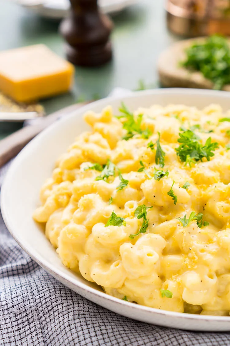 This really is the Best Ever Creamy Mac and Cheese! Made with sharp cheddar and Parmesan cheese, heavy cream and whole milk, richened with butter and kicked up with some mustard powder, you just can't go wrong! This stovetop mac and cheese recipe is on the table in just 25 minutes!