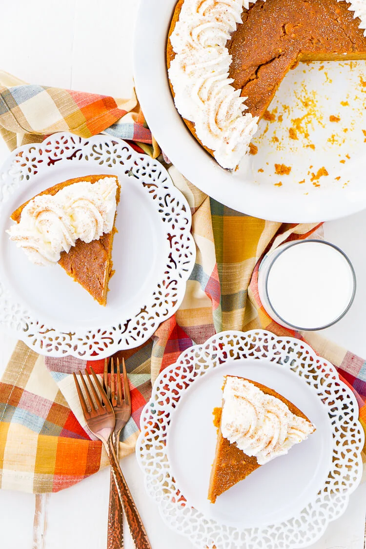 This Impossible Pumpkin Pie Recipe is actually the easiest pumpkin pie you'll ever make! As it bakes, it forms a light crust on its own and leaves behind a dense, but creamy pumpkin filling. Top it with whipped cream and it's the perfect fall dessert!