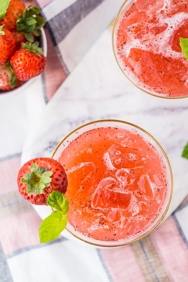This Strawberry Champagne Punch is the ultimate pink drink! It's sparkly, easy to make, and loaded with strawberry sweetness! It's perfect for bridal showers, baby showers, and New Year's Eve Parties!