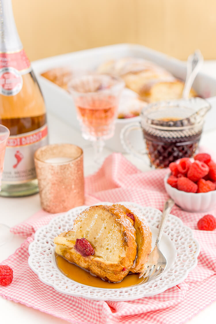 Champagne Raspberry Baked French Toast is the perfect way to kick off the New Year, Valentine's Day, or an anniversary! Prep it the night before so all you have to do is bake it in the morning!
