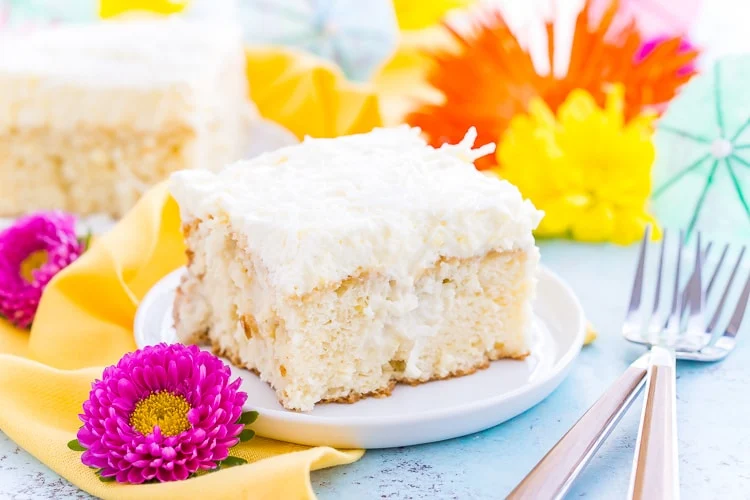 This Coconut Poke Cake is easy to make, loaded with coconut flavor, and the perfect dessert for your spring and summer celebrations.
