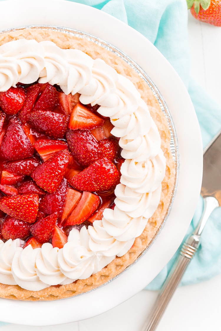 This Fresh Strawberry Margarita Pie is made with fresh, ripe strawberries, smooth Altos Tequila, and a few other simple ingredients for a boozy summertime dessert!