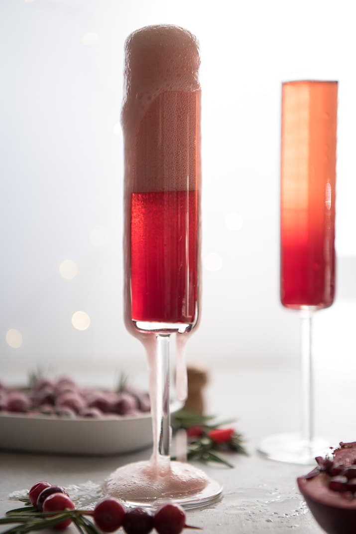 This pretty Cranberry Pomegranate Champagne Cocktail will fit right in during all your holiday festivities, but is versatile enough to be enjoyed any time of the year!