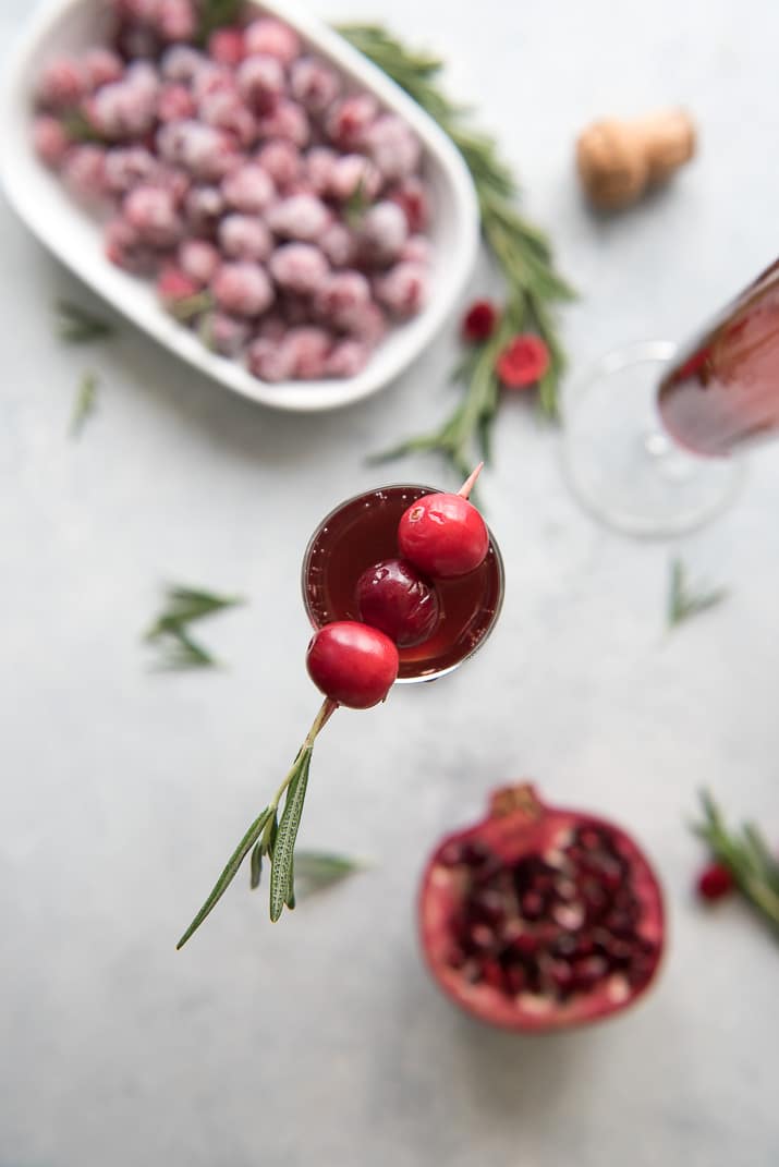 This pretty Cranberry Pomegranate Champagne Cocktail will fit right in during all your holiday festivities, but is versatile enough to be enjoyed any time of the year!