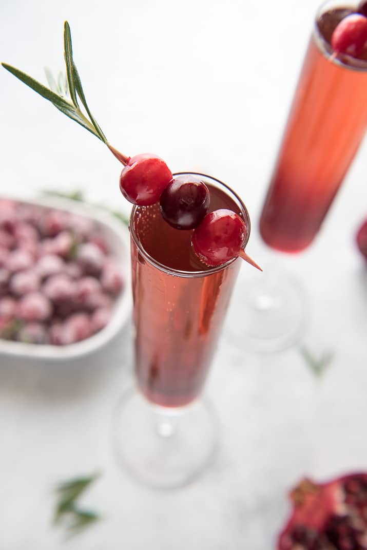 This pretty Cranberry Pomegranate Champagne Cocktail will fit right in during all your holiday festivities, but is versatile enough to be enjoyed any time of the year!