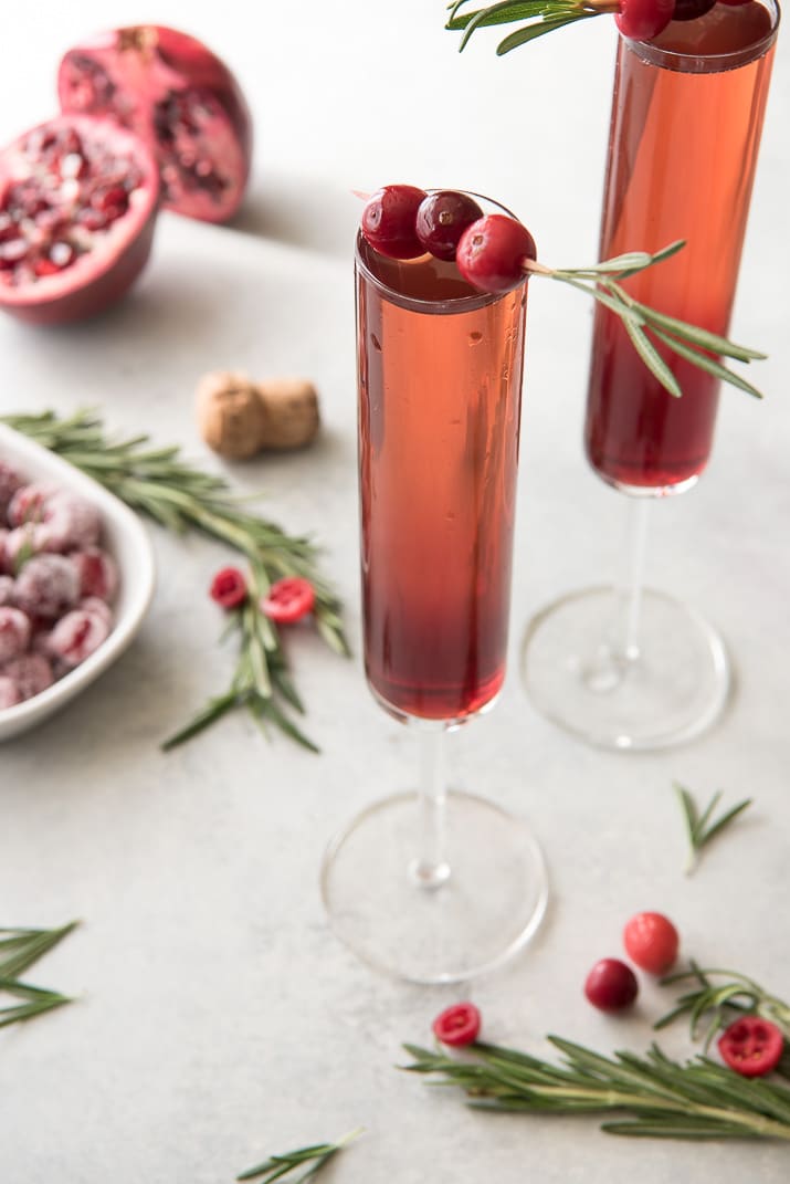 This pretty Cranberry Pomegranate Champagne Cocktail will fit right in during all your holiday festivities, but is versatile enough to be enjoyed any time of the year!