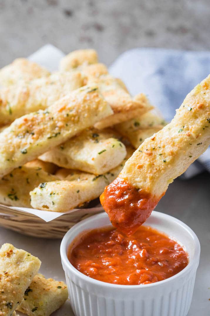 These homemade garlic parmesan breadsticks are so delicious and tempting. Fresh garlic, parmesan and subtle flavors of herbs make these breadsticks the best ever! And they are super easy to prepare.