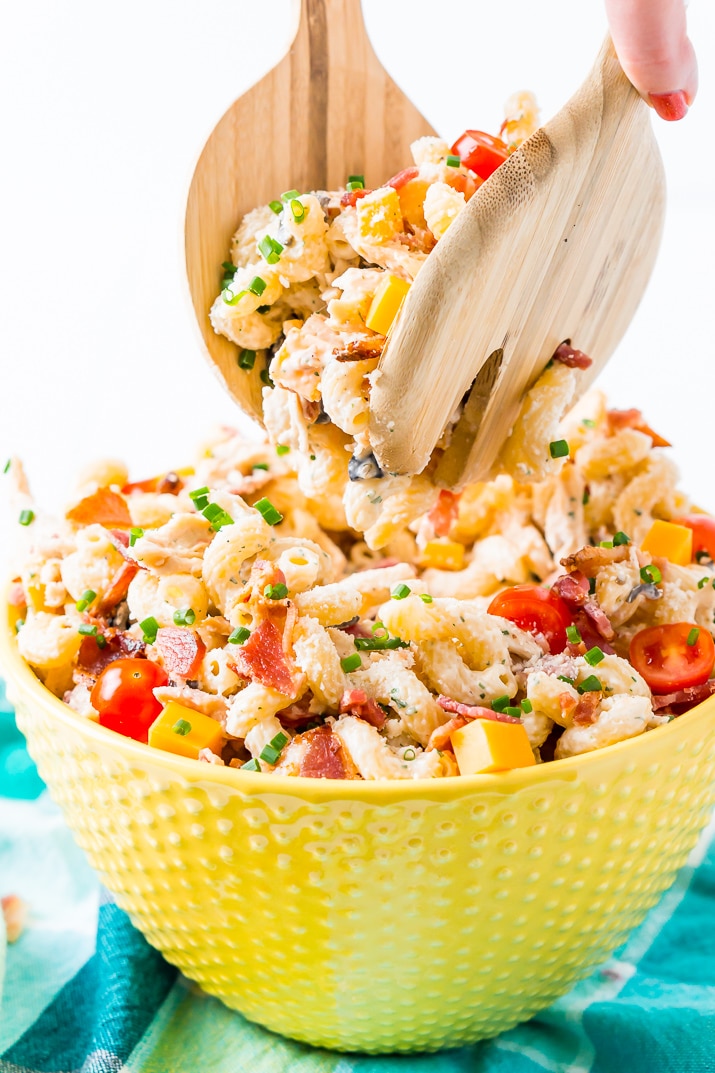 This Chicken Bacon Ranch Pasta Salad is going to be an instant hit at BBQs and picnics this summer! It's loaded with chicken, bacon, cheese, olives, and coated with a delicious ranch dressing.