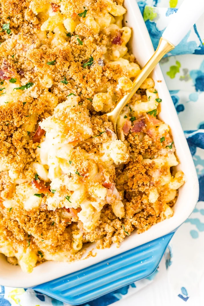 Three Cheese Bacon Mac and Cheese in Pan with serving spoon.