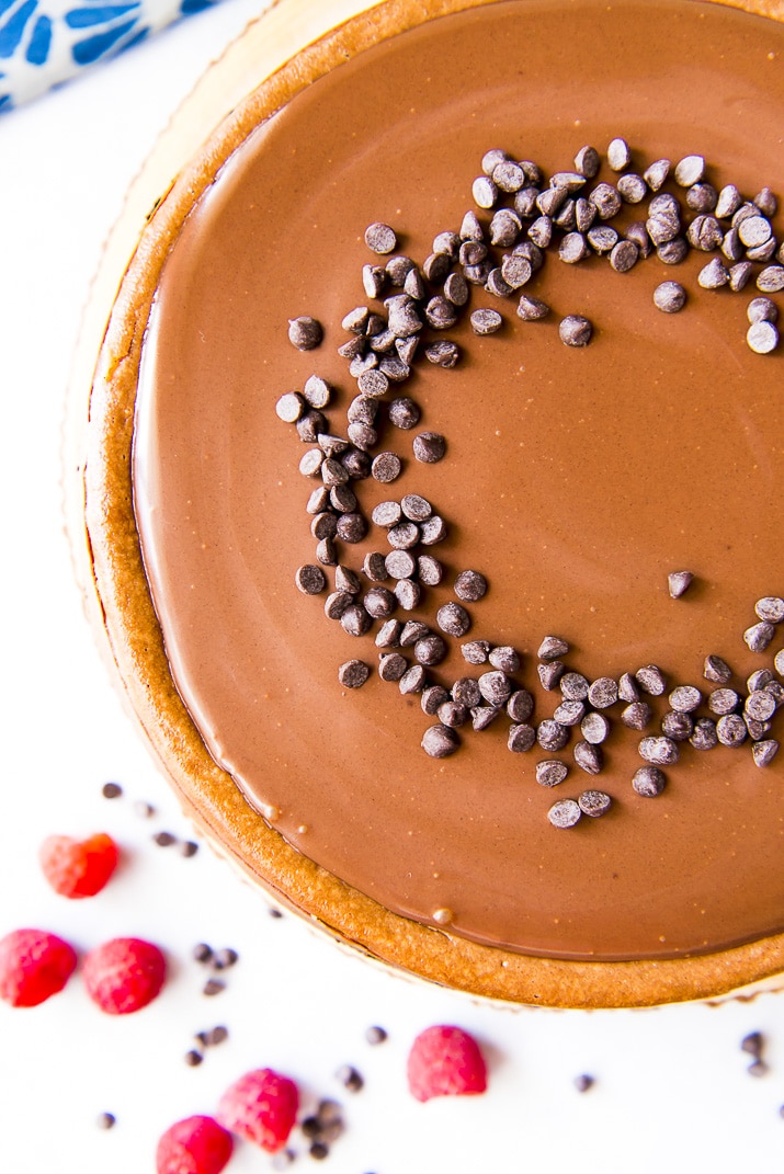 This is without a doubt the best triple chocolate cheesecake recipe you'll ever eat! Silky-smooth, creamy chocolate cheesecake is nestled in a chocolate cookie base, then garnished with a perfect dark chocolate ganache and a sprinkle of chocolate chips - whipped cream optional!