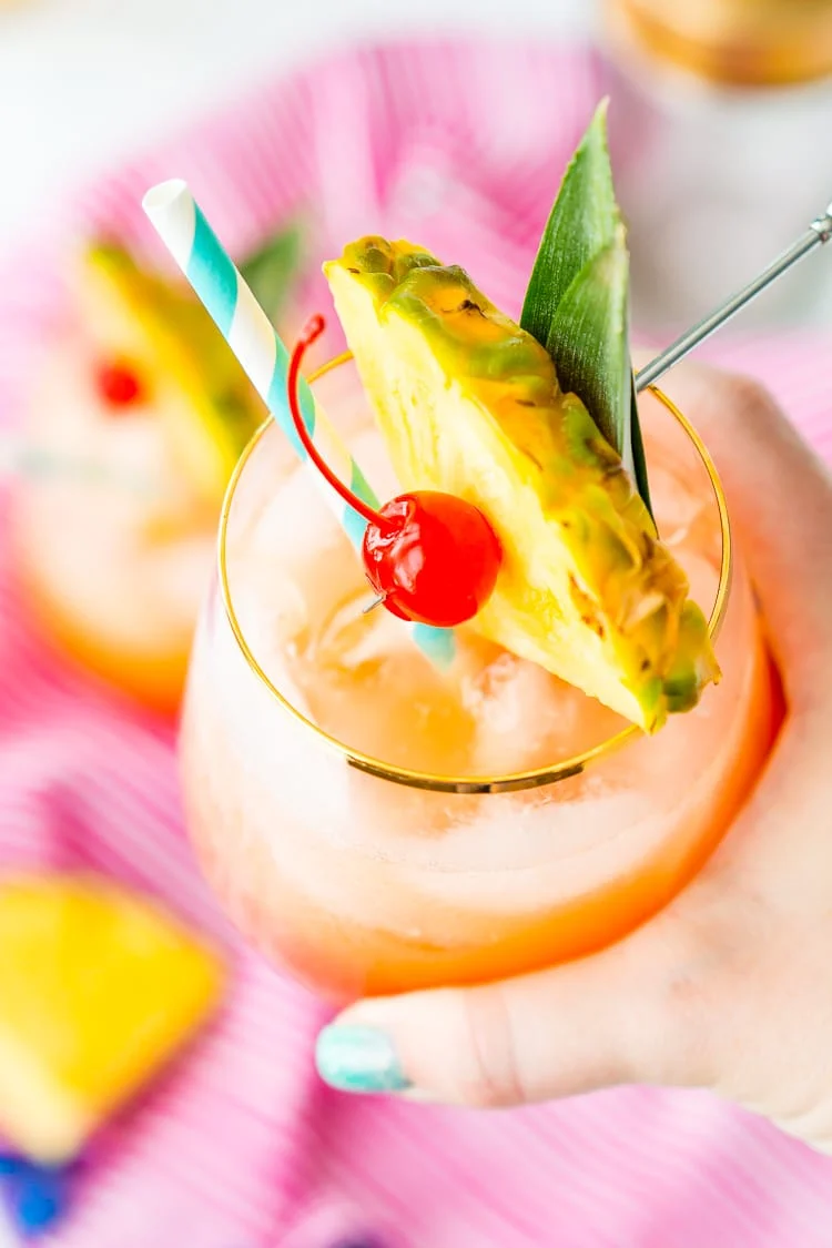 A Mai Tai is a boozy blend of coconut and spiced rum, triple sec, orange and pineapple juices, and a splash of grenadine. Mix up a batch for a taste of the tropics to enjoy with friends and family this summer.