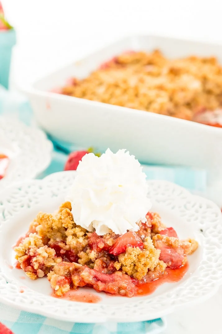 This Strawberry Rhubarb Crisp is an old-fashioned, simple, sweet, and tart summer dessert with a deliciously buttery and crispy crumble topping made from oatmeal and brown sugar.