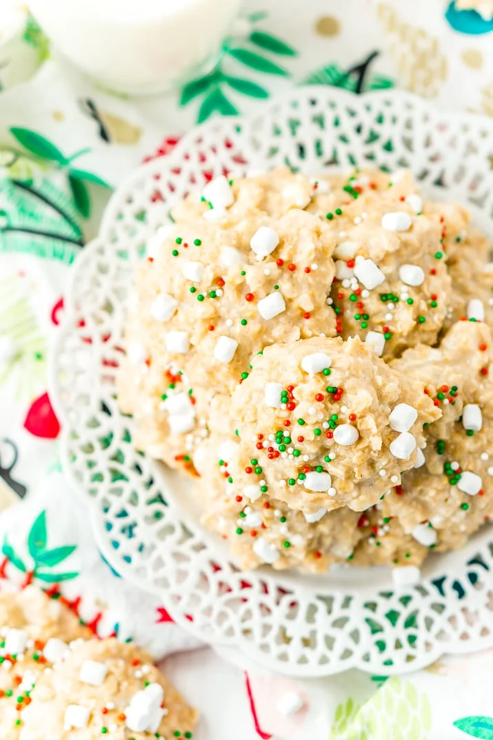 These White Hot Chocolate No Bake Cookies are so simple to make with butter, oatmeal, marshmallows, pudding, hot chocolate mix and more! They're nut and gluten free and Santa is sure to gobble them up!