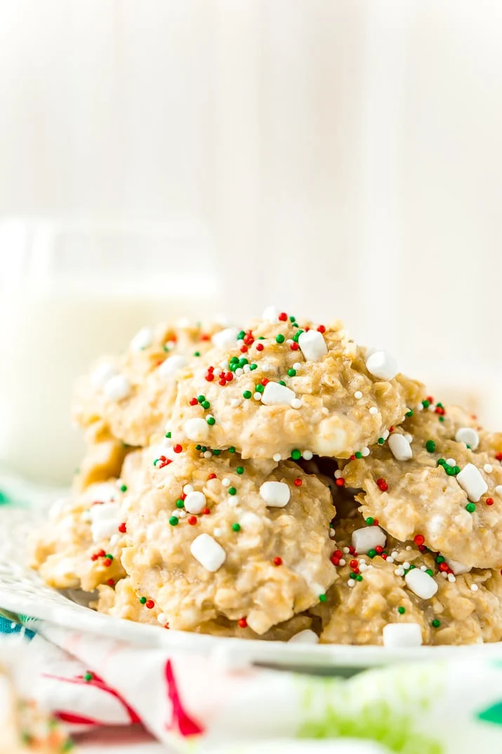 These White Hot Chocolate No Bake Cookies are so simple to make with butter, oatmeal, marshmallows, pudding, hot chocolate mix and more! They're nut and gluten free and Santa is sure to gobble them up!