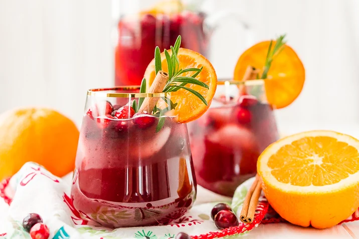 This Christmas Sangria is made with red wine, fruit juices, brandy, soda, and fruit for a delicious big-batch cocktail that's perfect for parties.