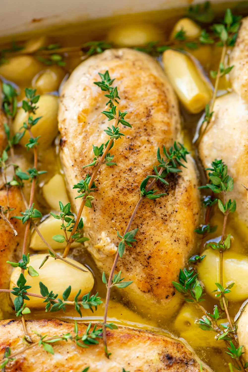 Garlic Chicken is a delicious dairy-free dinner recipe that's easy enough for weeknights and refined enough for special occasions. Made with chicken, garlic, olive oil, thyme, salt, and pepper.