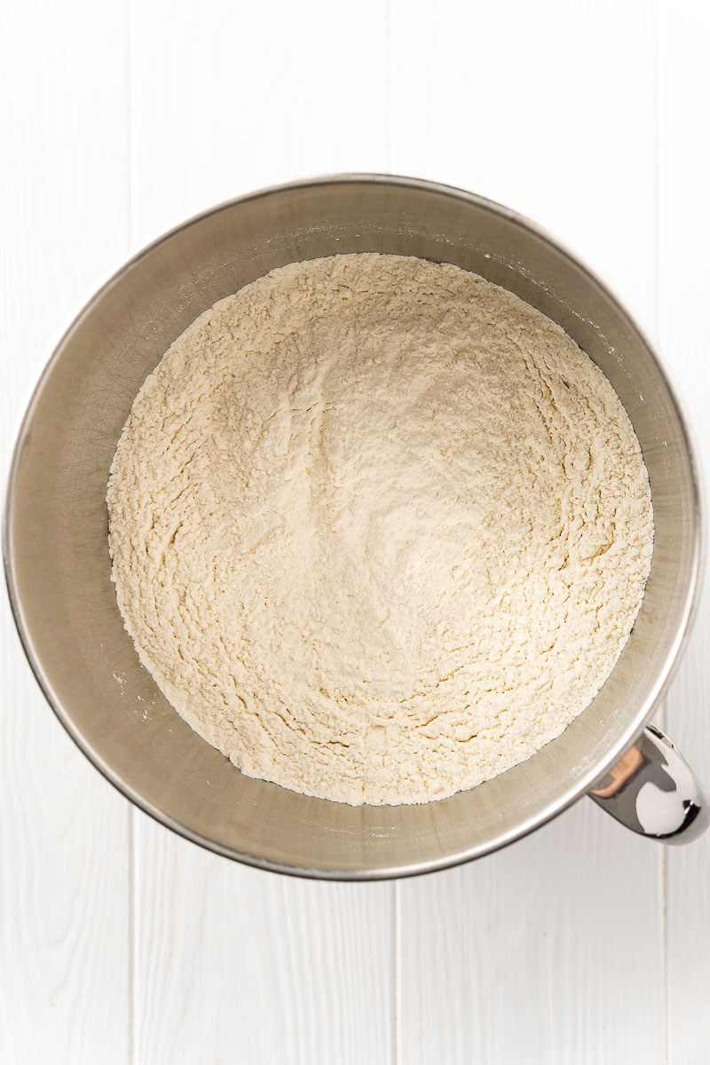 Dry ingredients to make bread in a stand mixer bowl.