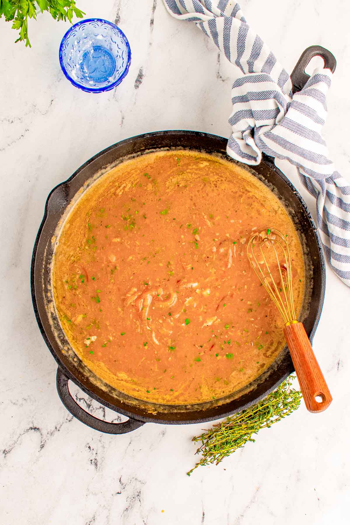 Onion gravy in a cast iron skillet.