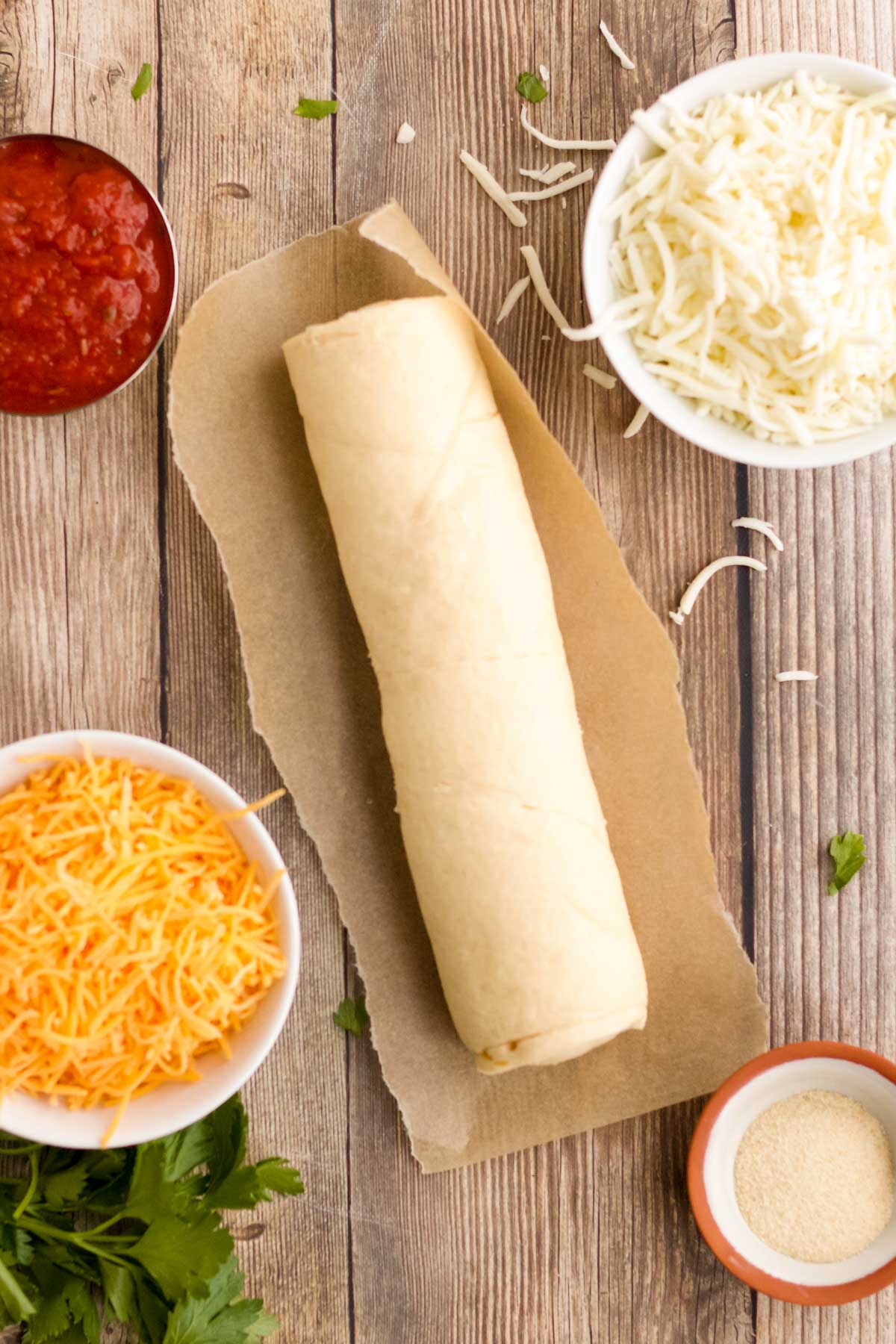 Overhead photo of ingredients to make cheesy breadsticks.